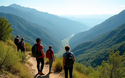 Hikers overlooking a green valley in Andalusia, practicing responsible tourism